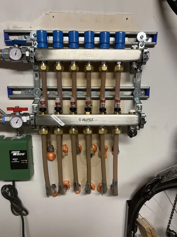 Plumber performing Gas Line Installation at a residential property in Anamosa